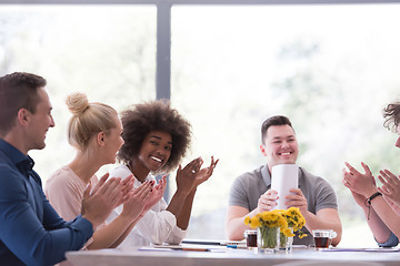 Image showing multiethnic startup Group of young business people celebrating s