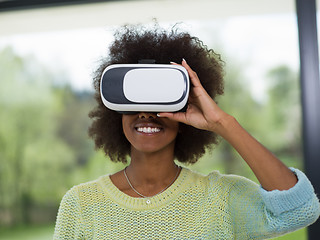 Image showing black woman using VR headset glasses of virtual reality