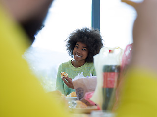 Image showing multiethnic group of happy friends lunch time