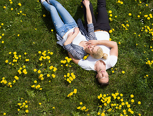 Image showing man and woman lying on the grass