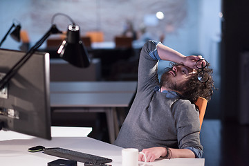 Image showing businessman relaxing at the desk