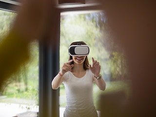 Image showing woman using VR-headset glasses of virtual reality