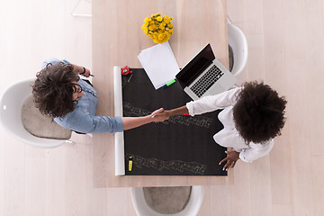 Image showing top view of Multiethnic startup business team on meeting