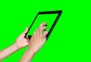 Image showing Business woman using a tablet computer on green screen