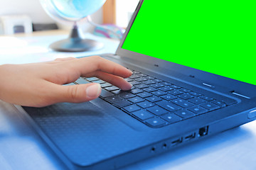 Image showing Women hands working on laptop in office on green screen