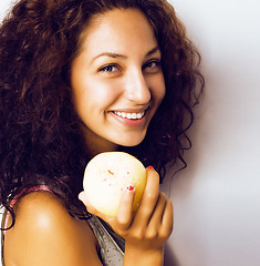 Image showing pretty young real tenage girl eating apple close up smiling