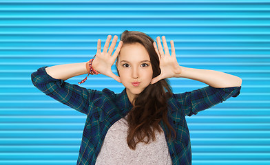 Image showing happy teenage girl making face and having fun