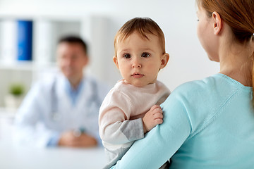 Image showing close up of mother with baby and doctor at clinic