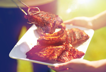 Image showing man cooking meat at summer party barbecue