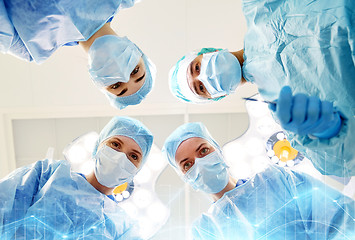 Image showing group of surgeons in operating room at hospital