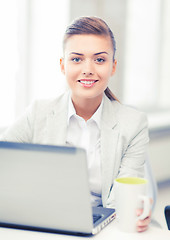 Image showing businesswoman with laptop in office