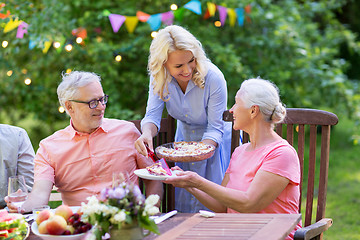 Image showing happy family having dinner or summer garden party