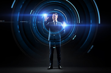 Image showing businessman in suit with virtual projection