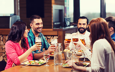 Image showing friends dining and drinking beer at restaurant