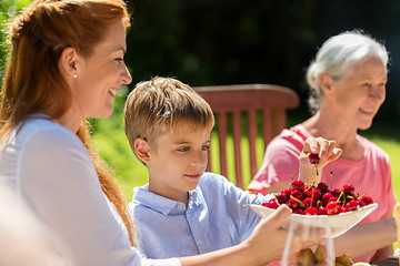 Image showing happy family having dinner or summer garden party