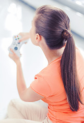 Image showing woman with joystick playing video games