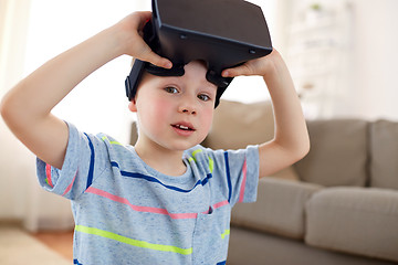 Image showing little boy in vr headset or 3d glasses at home