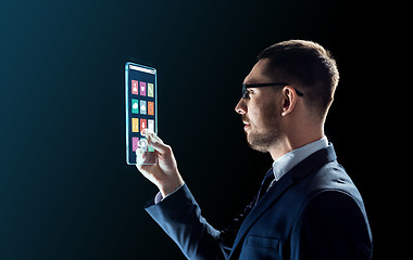 Image showing businessman working with transparent tablet pc