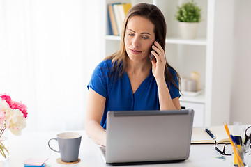 Image showing woman calling on smartphone at office or home