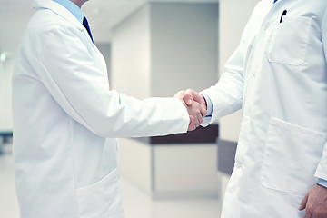 Image showing close up of doctors making handshake