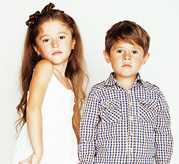 Image showing little cute boy girl hugging playing on white background, happy family close up isolated. brother and sister smiling