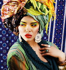 Image showing beauty bright woman with creative make up, many shawls on head l