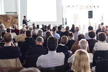 Image showing Business speaker giving a talk at business conference event.