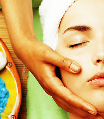 Image showing stock photo attractive lady getting spa treatment in salon, close up asian hands on face