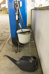 Image showing Bucket with water on gas station