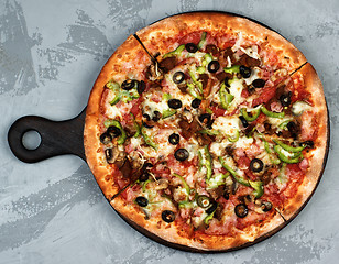 Image showing Delicious Pizza with Ham, Olives and Jalapenos