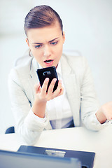 Image showing woman shouting into smartphone