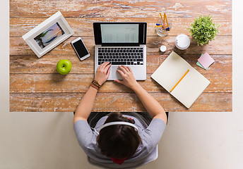 Image showing woman with receipt on laptop screen at office