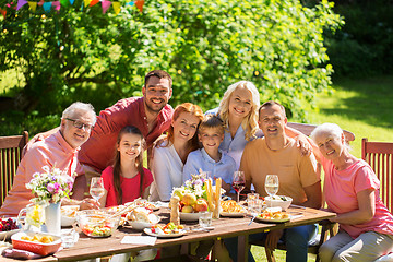 Image showing happy family having dinner or summer garden party