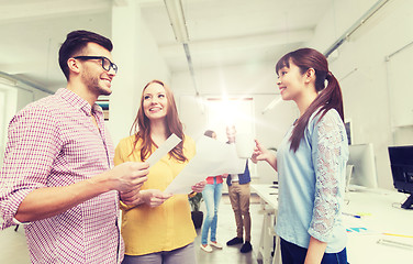 Image showing creative team on coffee break talking at office