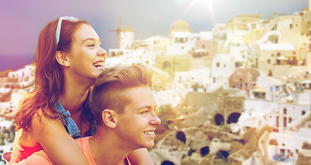 Image showing happy teenage couple having fun on santorini