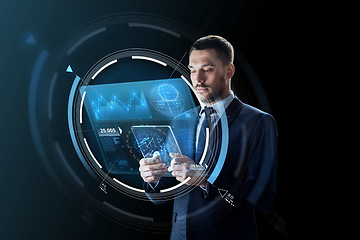 Image showing businessman with tablet pc and virtual projection