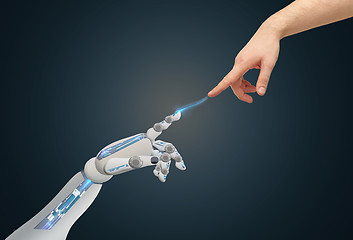 Image showing human and robot hands reaching to each other