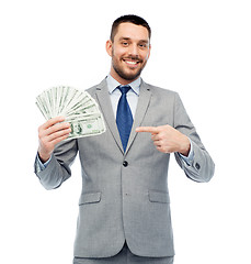 Image showing smiling businessman with american dollar money