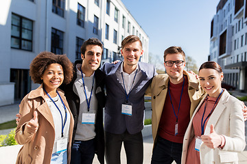 Image showing business team with conference badges in city