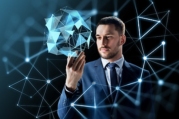 Image showing businessman with transparent smartphone