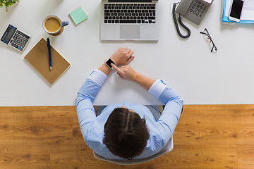 Image showing businesswoman working on laptop at office