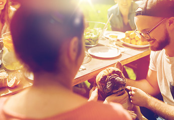 Image showing happy friends having dinner at summer garden party