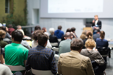 Image showing Man giving presentation in lecture hall at university.