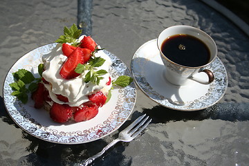 Image showing Pastry with Swedish strawberries and a cup of strong coffee