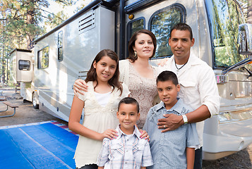 Image showing Happy Hispanic Family In Front of Their Beautiful RV At The Camp