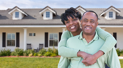 Image showing Happy African American Couple In Front of Beautiful House.