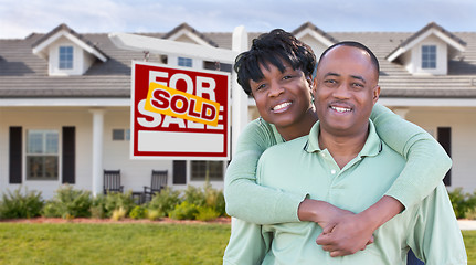 Image showing Happy African American Couple In Front of Beautiful House and So