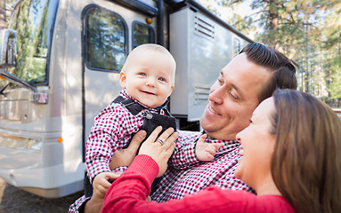 Image showing Happy Young Caucasian Family In Front of Their Beautiful RV At T