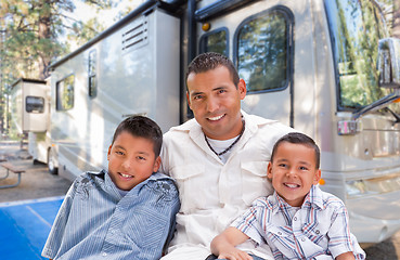 Image showing Happy Hispanic Father and Sons In Front of Their Beautiful RV At