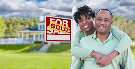 Image showing Happy African American Couple In Front of Beautiful House and So